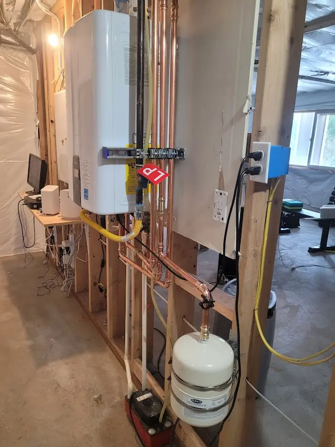 Licensed plumber repairing a kitchen sink in Plainfield
